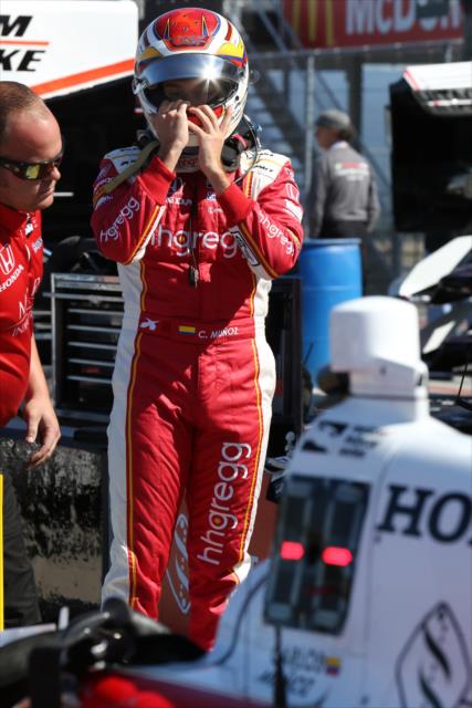 Carlos Munoz adjust his helmet along pit lane prior to practice for the INDYCAR Grand Prix at The Glen at Watkins Glen International -- Photo by: Chris Jones