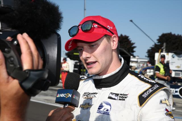 Josef Newgarden is interviewed by the media following his 2nd Place finish in the INDYCAR Grand Prix at The Glen from Watkins Glen International -- Photo by: Bret Kelley