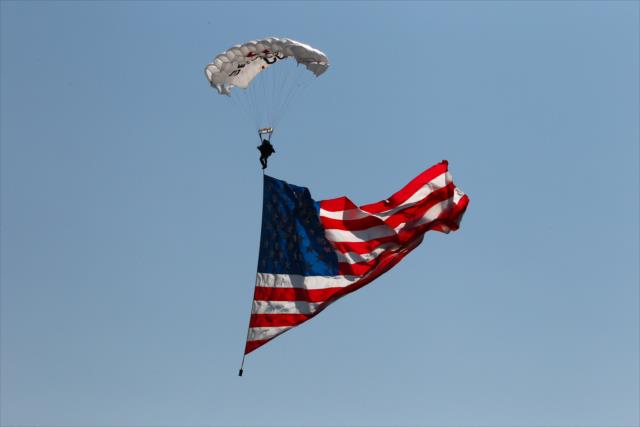 Skydivers bring in the American flag during pre-race festivities for the INDYCAR Grand Prix at The Glen from Watkins Glen International -- Photo by: Bret Kelley