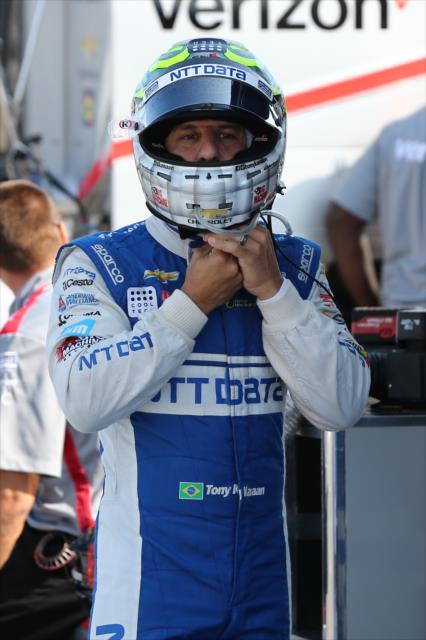 Tony Kanaan straps on his helmet prior to the final warmup for the INDYCAR Grand Prix at The Glen from Watkins Glen International -- Photo by: Chris Jones
