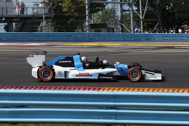 Mario Andretti navigates the Honda Fastest Seat In Sports Two-Seater during the parade laps prior to the INDYCAR Grand Prix at The Glen from Watkins Glen International -- Photo by: Chris Jones