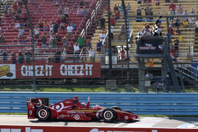 Scott Dixon takes the twin checkers to win the INDYCAR Grand Prix at The Glen from Watkins Glen International -- Photo by: Chris Jones