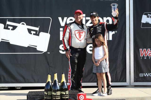 Helio Castroneves hoists his 3rd Place trophy in Victory Lane following the INDYCAR Grand Prix at The Glen from Watkins Glen International -- Photo by: Chris Jones