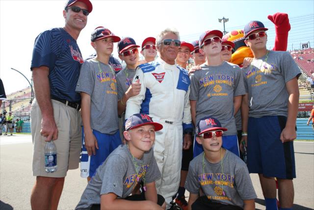 Mario Andretti poses with the 2016 Little League World Series Champions from Maine-Endwell during pre-race festivities for the INDYCAR Grand Prix at The Glen from Watkins Glen International -- Photo by: Chris Jones