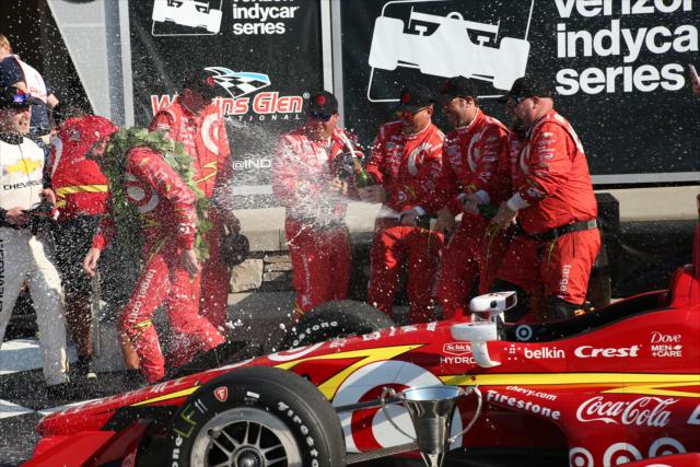Scott Dixon gets a champagne shower in Victory Lane from his Chip Ganassi Racing crew following his win in the INDYCAR Grand Prix at The Glen from Watkins Glen International -- Photo by: Chris Jones