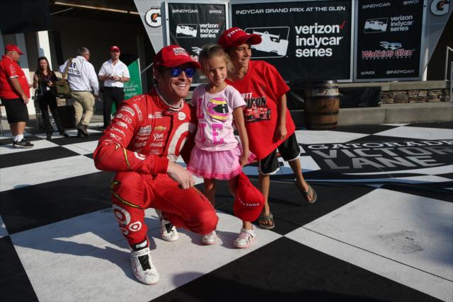 Scott Dixon poses with a few kids in Victory Lane following his win in the INDYCAR Grand Prix at The Glen from Watkins Glen International -- Photo by: Chris Jones