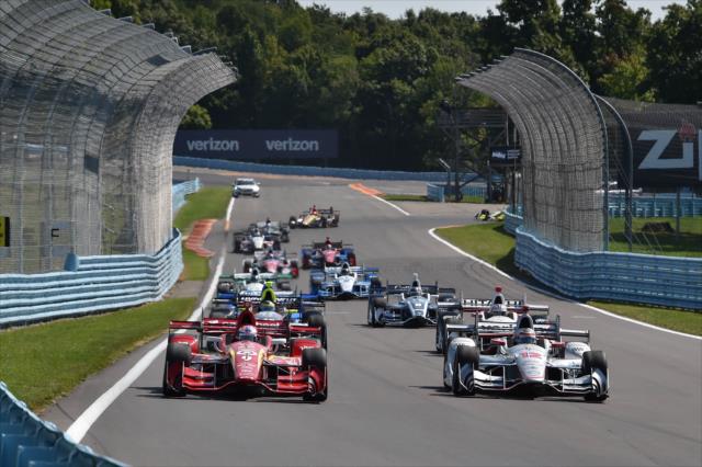 Scott Dixon and Will Power lead the field into Turn 9 during the pace lap prior to the start of the INDYCAR Grand Prix at The Glen from Watkins Glen International -- Photo by: Chris Owens