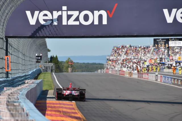 Scott Dixon exits Turn 11 toward the frontstretch during the INDYCAR Grand Prix at The Glen from Watkins Glen International -- Photo by: Chris Owens
