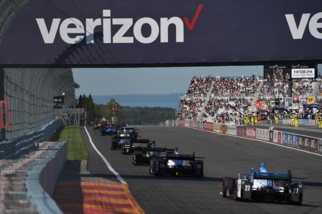 The field streams out of Turn 11 toward the frontstretch during the INDYCAR Grand Prix at The Glen from Watkins Glen International -- Photo by: Chris Owens