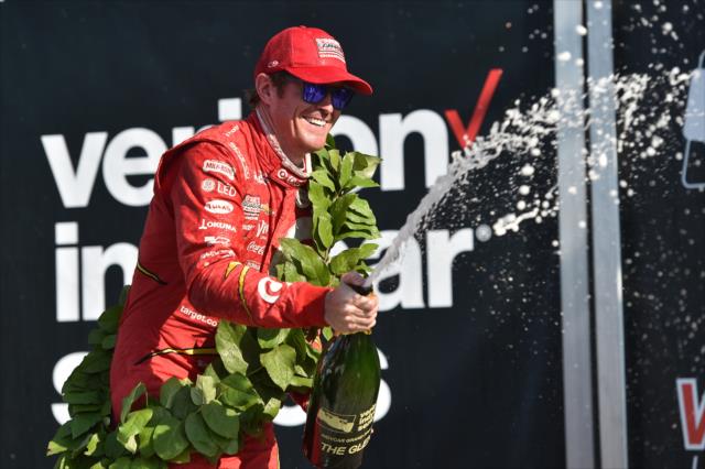 Scott Dixon sprays the champagne in Victory Lane following his win in the INDYCAR Grand Prix at The Glen from Watkins Glen International -- Photo by: Chris Owens