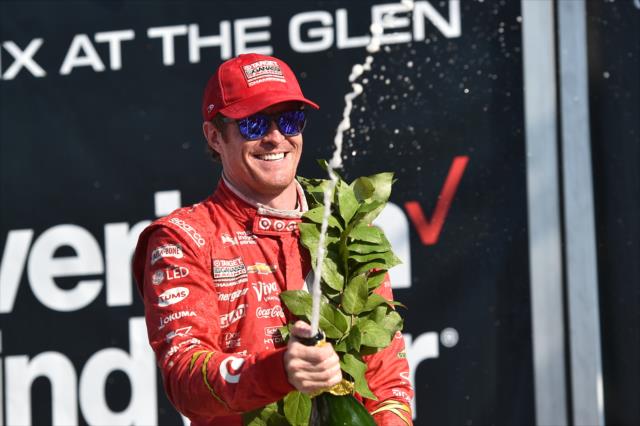 Scott Dixon sprays the champagne in Victory Lane following his win in the INDYCAR Grand Prix at The Glen from Watkins Glen International -- Photo by: Chris Owens