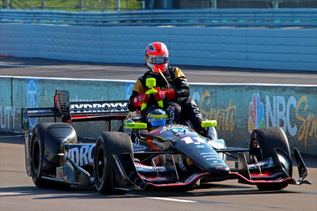 James Hinchcliffe hitches a ride with Sebastien Bourdais at the conclusion of the INDYCAR Grand Prix at The Glen from Watkins Glen International -- Photo by: Mike Harding