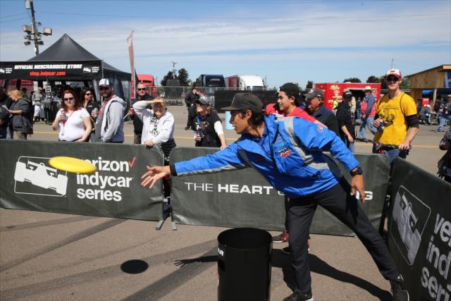 Neil Alberico lets his Frisbee fly during a game of KanJam with INDYCAR Nation Pit Crew members in the INDYCAR Fan Village at Watkins Glen -- Photo by: Chris Jones
