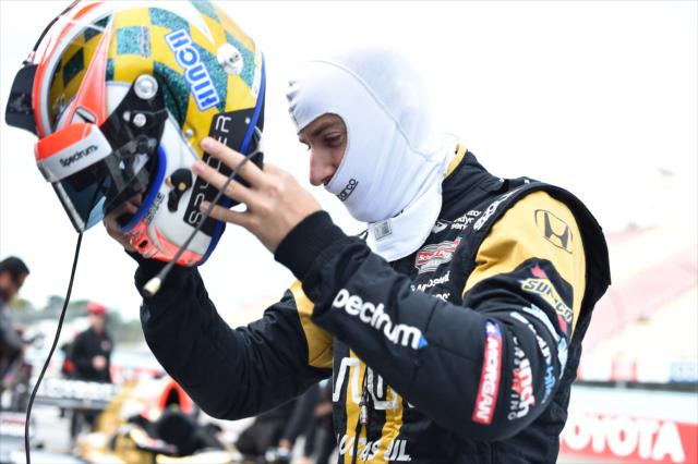 James Hinchclife puts on his helmet prior to qualifications for the INDYCAR Grand Prix at The Glen -- Photo by: Chris Owens